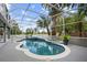 Enjoy a private screened pool area with a spa, perfect for relaxation and outdoor entertaining at 13044 Lakeshore Grove Dr, Winter Garden, FL 34787