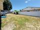 Large fenced backyard with ample space for outdoor activities and potential landscaping opportunities at 1419 Avenue D Ne, Winter Haven, FL 33881