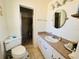 Well-maintained bathroom with a shower, vanity, and toilet, creating a functional and clean space at 1419 Avenue D Ne, Winter Haven, FL 33881