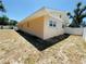 Exterior of the property showing the backyard and privacy fence at 1419 Avenue D Ne, Winter Haven, FL 33881