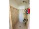 Tiled shower featuring a shower head and a small bench, perfect for a refreshing and modern bathroom at 1419 Avenue D Ne, Winter Haven, FL 33881