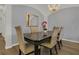 Elegant dining room with a chandelier, a stylish mirror, and seating for six at 147 Bridgewater Dr, Davenport, FL 33897