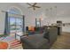 Cozy living room with a view of the pool, open to the kitchen and dining area at 147 Bridgewater Dr, Davenport, FL 33897