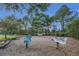 Community playground with swings and fun spring rider toys at 147 Bridgewater Dr, Davenport, FL 33897