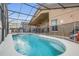 Enjoy the Florida sunshine in this screened pool with a relaxing spa at 147 Bridgewater Dr, Davenport, FL 33897