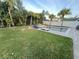 Lush backyard with a gorgeous pool, chaise lounge, privacy fence, and well-manicured lawn at 14963 Yorkshire Run Dr, Orlando, FL 32828