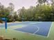 Outdoor basketball court surrounded by trees at 14963 Yorkshire Run Dr, Orlando, FL 32828