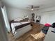 This bedroom offers natural light from the window and stylish wood-look vinyl floors at 14963 Yorkshire Run Dr, Orlando, FL 32828