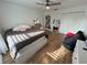 This bedroom offers natural light from the window and stylish wood-look vinyl floors at 14963 Yorkshire Run Dr, Orlando, FL 32828
