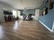 Spacious bonus room with natural light and wood-look vinyl floors and built-in cabinets at 14963 Yorkshire Run Dr, Orlando, FL 32828