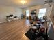 Spacious bonus room with hardwood floors, windows and equipped with a computer station and musical instruments at 14963 Yorkshire Run Dr, Orlando, FL 32828
