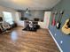 Bonus room with a drum set, storage cabinets, and guitars mounted on the wall at 14963 Yorkshire Run Dr, Orlando, FL 32828