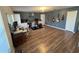 Spacious bonus room with natural light and wood-look vinyl floors and built-in cabinets at 14963 Yorkshire Run Dr, Orlando, FL 32828