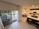 Bright open kitchen with modern appliances, a center island, and a view of the backyard pool at 14963 Yorkshire Run Dr, Orlando, FL 32828