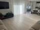 Expansive living room offers lots of natural light, media center, open concept design leading to dining area and kitchen at 14963 Yorkshire Run Dr, Orlando, FL 32828