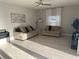 Spacious living area flows into the kitchen, featuring ample space, tile floors, and lots of natural light throughout at 14963 Yorkshire Run Dr, Orlando, FL 32828