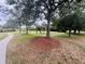 A tranquil park setting with mature trees and green spaces, perfect for leisurely strolls and relaxation at 14963 Yorkshire Run Dr, Orlando, FL 32828
