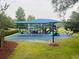 A modern, colorful playground offers a safe and engaging space for children to play and explore at 14963 Yorkshire Run Dr, Orlando, FL 32828