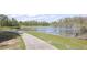 Picturesque walking path alongside a serene lake, perfect for leisurely strolls and enjoying nature's beauty at 14963 Yorkshire Run Dr, Orlando, FL 32828