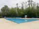 A large community pool surrounded by lounge chairs, offering a refreshing oasis for relaxation and recreation at 14963 Yorkshire Run Dr, Orlando, FL 32828