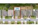 Overhead shot of house featuring a private pool, a well-manicured lawn and a two-car garage at 1557 Alligator St, St Cloud, FL 34771
