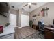 Cozy bedroom with wood-look floors, a ceiling fan, and ample closet space at 1557 Alligator St, St Cloud, FL 34771
