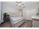 Bright bedroom features wood floors, ceiling fan, and closet for plenty of storage at 1557 Alligator St, St Cloud, FL 34771