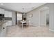 Dining area featuring a white table with seating for six with a seamless transition into the kitchen at 1557 Alligator St, St Cloud, FL 34771