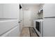 Well-lit laundry room with washer, dryer, and storage, providing convenience at 1557 Alligator St, St Cloud, FL 34771