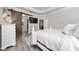 The main bedroom features a sliding barn door, tray ceilings, and wood-look floors at 1557 Alligator St, St Cloud, FL 34771