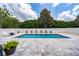 Backyard boasts a pristine pool surrounded by a stylish paved patio, ideal for relaxation at 1557 Alligator St, St Cloud, FL 34771