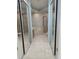 Bathroom featuring a double shower and soaking tub with tile surround and mirrored closet at 15851 Woodland Spring Ct, Orlando, FL 32828