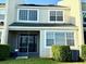 Inviting two-story home with large windows, screened in lanai, well-maintained lawn and manicured bushes at 15851 Woodland Spring Ct, Orlando, FL 32828
