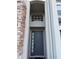 View of front door with stone facade and detailed window at 15851 Woodland Spring Ct, Orlando, FL 32828
