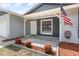 Welcoming front entrance with tidy landscaping, a decorative sidewalk, and a freshly painted front door at 1622 Crystalview Trl, Lakeland, FL 33801