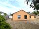 Home with a fenced backyard featuring large windows and mature trees at 1820 Hallcrest Dr, Deltona, FL 32725