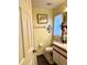 Modest bathroom featuring a toilet, vanity, and framed floral artwork at 1820 Hallcrest Dr, Deltona, FL 32725