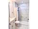 Updated bathroom boasts marble-look tile and a modern shower at 1820 Hallcrest Dr, Deltona, FL 32725