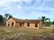 Single-story home featuring a brown roof and an expansive lawn at 1820 Hallcrest Dr, Deltona, FL 32725