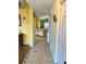 Hallway view shows tile flooring and leads into an open layout with dining area at 1820 Hallcrest Dr, Deltona, FL 32725