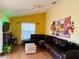 Living room featuring a large sectional couch, tv and hardwood floors at 1820 Hallcrest Dr, Deltona, FL 32725