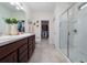 Modern bathroom featuring a double sink vanity, glass-enclosed shower, and neutral color scheme at 1821 Cayman Cove St., St Cloud, FL 34772