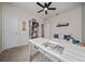 Spare bedroom featuring neutral walls, work desk, and a ceiling fan at 1821 Cayman Cove St., St Cloud, FL 34772