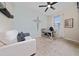 Comfortable bedroom featuring neutral walls, work desk, and a ceiling fan at 1821 Cayman Cove St., St Cloud, FL 34772