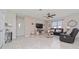 Comfortable living room with stylish furnishings, neutral color palette, and tile flooring, creating a cozy and inviting atmosphere at 1821 Cayman Cove St., St Cloud, FL 34772