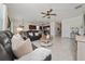Open-concept living room with tile floors, comfortable seating, and a view of the kitchen at 1821 Cayman Cove St., St Cloud, FL 34772
