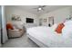 Bright main bedroom featuring tile floors, a dresser and a ceiling fan at 1821 Cayman Cove St., St Cloud, FL 34772