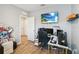 Bedroom workspace featuring three monitors, a view into other rooms and a wall mounted television at 2281 Canyon Breeze Ave, Kissimmee, FL 34746