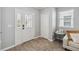 Inviting entryway with tiled floors, decorative glass front door, and a coat closet at 2281 Canyon Breeze Ave, Kissimmee, FL 34746