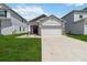 Charming single-story home featuring a well-manicured lawn and a two car garage at 2281 Canyon Breeze Ave, Kissimmee, FL 34746